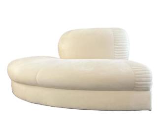 CURVED LOVESEAT | Love seat or corner lounge chair in creme colored ultra suede upholstery, pairs with the sectional sofa (lot #5) or can be used as a stand alone chair; seat h. 16 in. - h. 30 x l. 71 in
