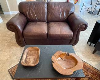 Leather Love seat with brass stud detailing
Natural Wood Bowls 
