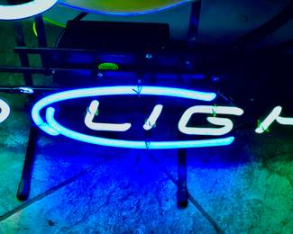 Close up of Bud Light neon glows blue