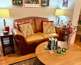 Leather loveseat and golf decor