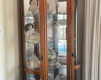 curio cabinet & dolls & misc