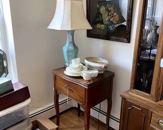 Lamp refurbished old sewing machine.  Floral pastel is sold. 
