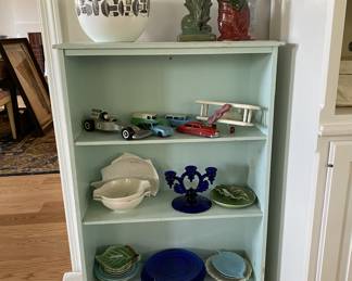 Bookcase and items for sale.