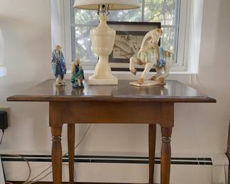 One of two end tables, alabaster lamp, repro tang horse, mud-men.