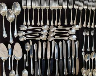 SS Ice cream forks in center! Closeup. Left side view.