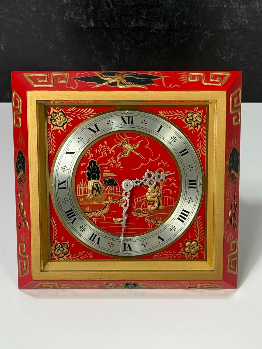 Chelsea Clock Co. "Chinese Lacquer" desk clock, 8-day spring driven brass lever movement.  Hand painted enamel case with black and gold design on a red background.  Chelsea produced these clocks for Tiffany & Co.  