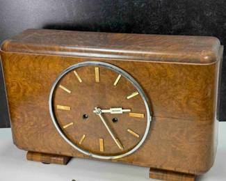 Good example of a walnut Art Deco Mantle clock by Germany’s oldest watchmakers, Kienzle. A quality 8-day movement, which chimes the hour.   Art Deco, walnut mantel clock in walnut, includes original key and pendulum.