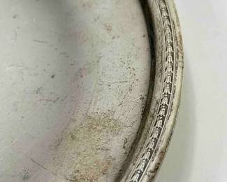 Large sterling silver plate, measuring 9 ½” in dimeter and weighing 11.2 troy ounces.