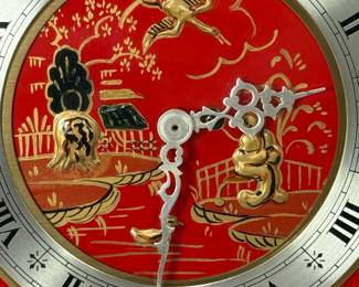 Chelsea Clock Co. "Chinese Lacquer" desk clock, 8-day spring driven brass lever movement.  Hand painted enamel case with black and gold design on a red background.  Chelsea produced these clocks for Tiffany & Co.  