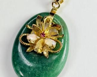 14K gold pendant, green jade or quartz, garnet and opals. 