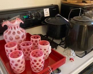 Fenton cranberry pieces. The glasses are in excellent condition but unfortunately the pitcher has a broken spout. 