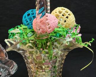 Glass Easter basket with crocheted eggs
