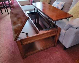 Storage and adjustable coffee table