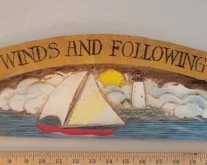Carved coastal sign