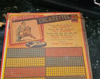 Vintage "1 Cent Cigarette Punch Board," a type of gambling or trade stimulator device. It was used in bars or taverns