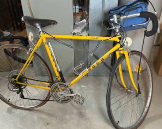Yellow Mountain Bike With Attached Tire Pump
