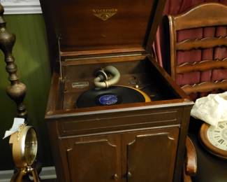 Victrolia with dog labels tends on legs open doors for speakers
