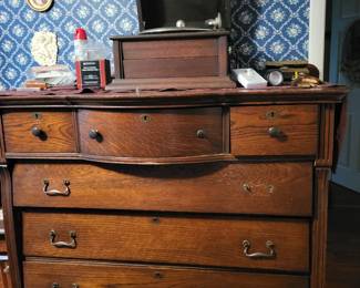 Chest of drawers with old small record player on top
