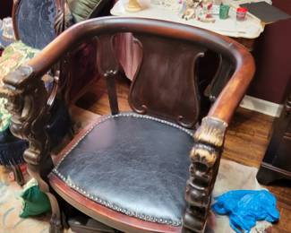 Carved heads griffin chair
