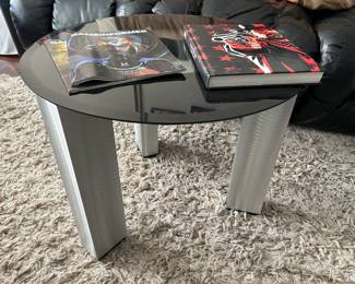 pair of end tables, one on casters