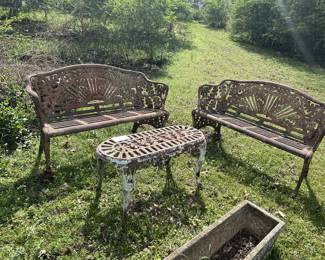Cast iron benches and table sold as a set