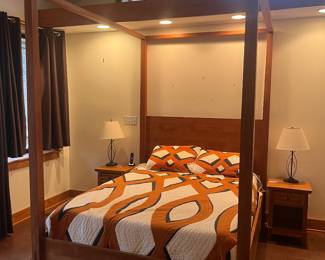 Four poster teak wood bed frame with matching end tables. In perfect condition. 