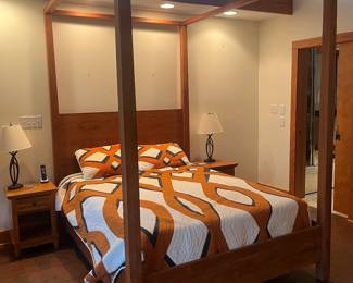 Four poster teak wood bed frame with matching end tables. In perfect condition. 