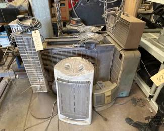 1224  2 Shop Vacs Heaters Fans and Creeper