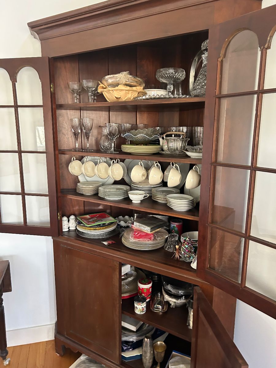 CHINA CORNER CABINET WITH UNPACKED GOODIES.