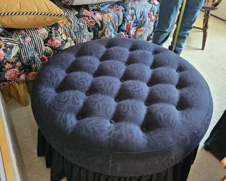 Tufted round navy ottoman