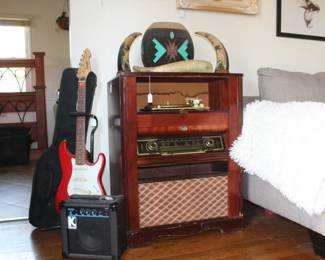 One electric and two acoustic guitars, KUSTOM amp, German Vintage tuner record player combo cabinet, Vintage asian water, buffalo horn