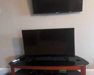 Multiple TVs and TV stand