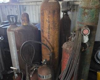 Assortment of propane and Hellium Tanks