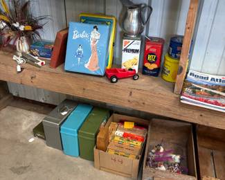 Barbie cases with dolls and clothes inside