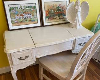 This desk is just as cute as the needlepoint town scenes it holds.