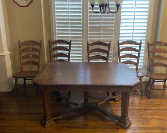 Solid table with six lovely chairs.