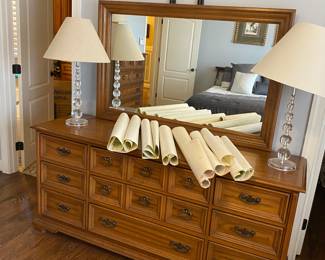 Nice dresser covered in nautical navigation maps that would be cool to frame.