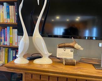 Groovy bird pair alongside caribou bone knife.