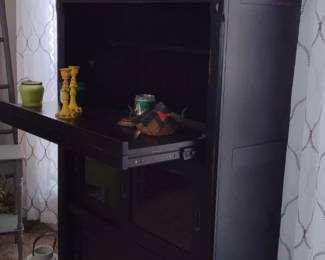 $300 Unique Dark Brown Cabinet, with option for standup computer pull out shelf and 2 sliding storage shelves below.
