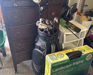Another set of golf clubs, antique dresser and landscape materials 