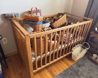 Crib full of longaberger baskets
