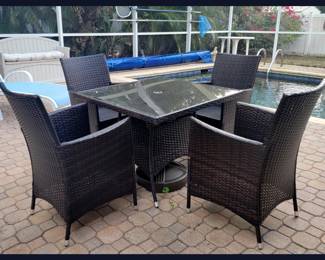 All Weather Wicker Outdoor Dining Set with an Umbrella Stand; There is an Umbrella not shown