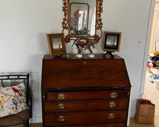 French Louis XV style relief carved gilt wood rectangular wall mirror first quarter 20th century with sea scroll, and foliate pierced cornice above

English George III MAHOGANY VENEER SECRETARY DESK FOURTH QUARTER 18TH CENTURY, THE RECTANGULAR TOP ABOVE A HINGE SLANT FRONT OPENING
