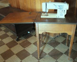 21 - Universal Sewing Machine w/ Stand - 31"x 24"x18" You are buying a used as-is electric/electronic item. We do not guarantee all components are present, and if it is not expressly stated, it is untested.