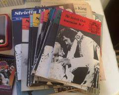 Large variety of Elvis magazines and books, cards, plates, stamps, and memorabilia