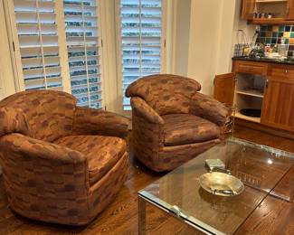 360 degree modern swivel chairs and an elegant modern glass top coffee table