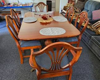 Antique dining table, circa 1954.