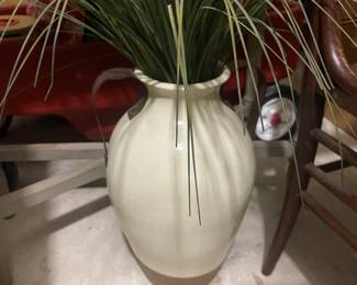 Pottery jug with flower arrangement