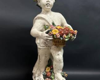 Italian polychrome decorated cherub statue holding a basket of flowers