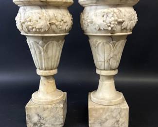 Pair of classical alabaster urns on pedestals